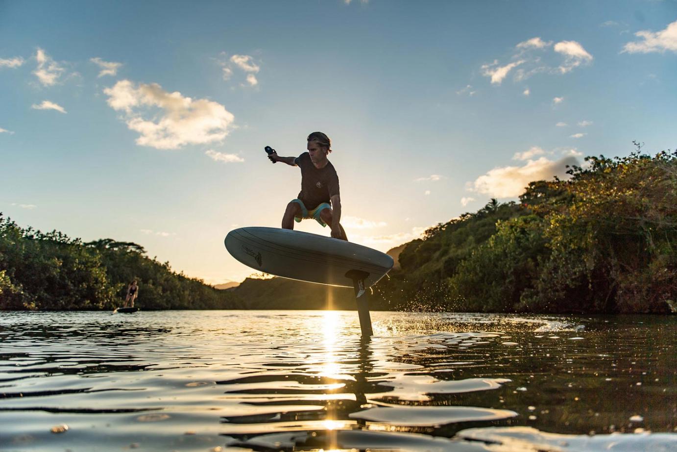 Man surfing on powered surfboard